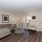 Spacious Living Area with Wood Vinyl in Select Homes